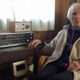 98-year-old Judith Haaland sits next to her decades-old radio set in Stavanger, Norway. By the end of the year, national networks will be available only on Digital Audio Broadcast, or DAB. (Image: AP)